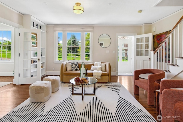 4404 Montana Cir W, Seattle, WA 98199 - living area with wood finished floors, baseboards, stairway, and crown molding