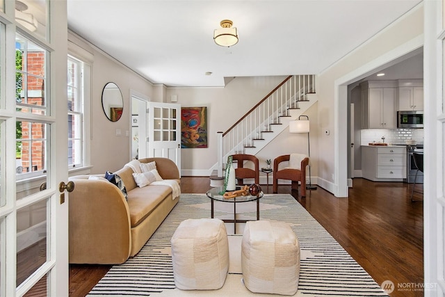 4404 Montana Cir W, Seattle, WA 98199 - living area with dark wood-type flooring, stairway, french doors, and baseboards