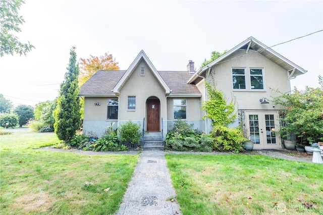 2010 13th Ave NW, Puyallup, WA 98371 - view of front facade featuring french doors, stucco siding, and a front yard