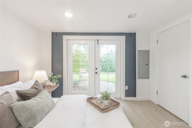 2010 13th Ave NW, Puyallup, WA 98371 - bedroom with electric panel, access to exterior, light wood-style floors, baseboards, and french doors