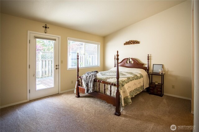 2016 Creekside Ln, Anacortes, WA 98221 - carpeted bedroom with access to exterior, baseboards, and lofted ceiling
