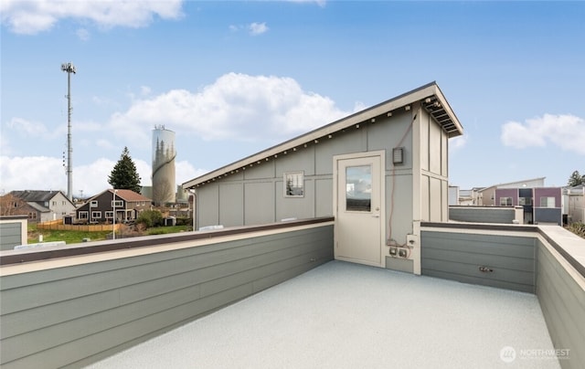 exterior space featuring a balcony and board and batten siding