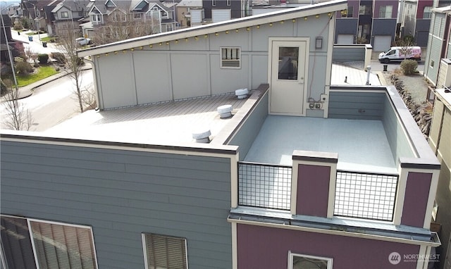 view of property exterior featuring a residential view and a balcony
