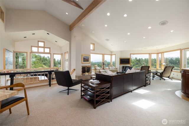 living area with light colored carpet, recessed lighting, high vaulted ceiling, and a fireplace