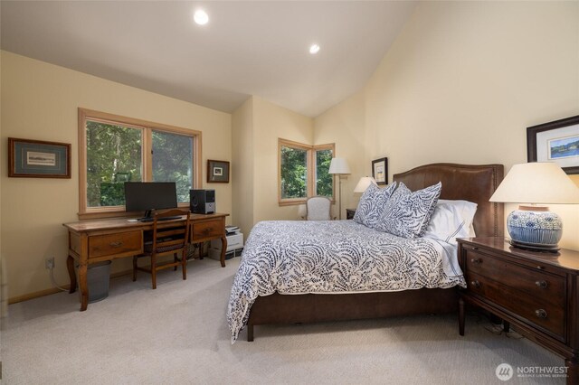 bedroom with light colored carpet, an office area, multiple windows, lofted ceiling, and recessed lighting