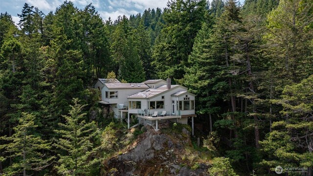 view from above of property featuring a forest