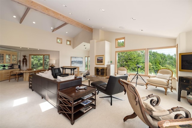living area with light carpet, recessed lighting, high vaulted ceiling, a glass covered fireplace, and beamed ceiling