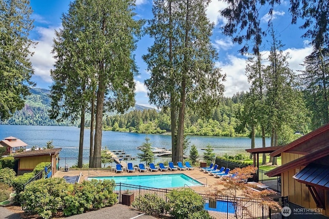 990 Lake Whatcom Blvd Unit 11, Sedro Woolley, WA 98284 - community pool featuring fence, a water view, a patio, and a forest view