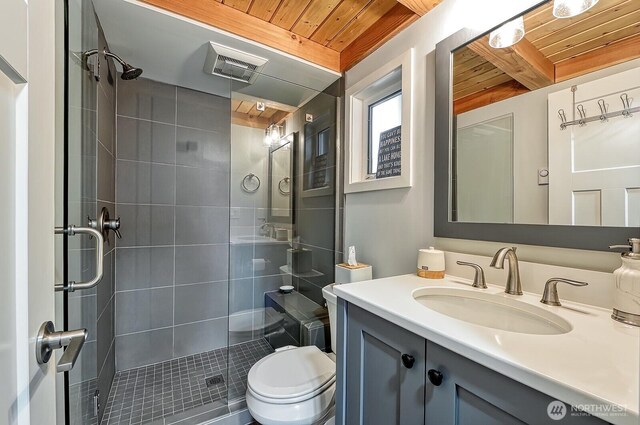 990 Lake Whatcom Blvd Unit 11, Sedro Woolley, WA 98284 - full bathroom featuring wood ceiling, a shower stall, toilet, vanity, and beam ceiling