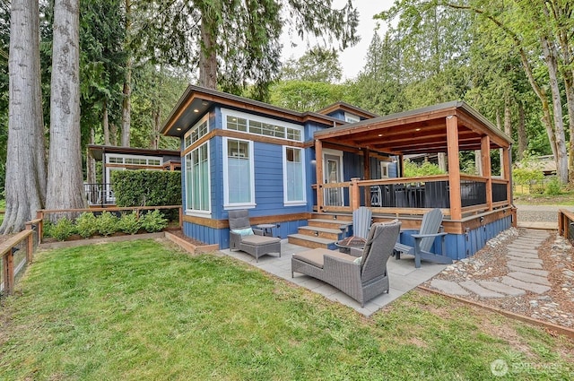 990 Lake Whatcom Blvd Unit 11, Sedro Woolley, WA 98284 - rear view of property with a patio area and a wooden deck