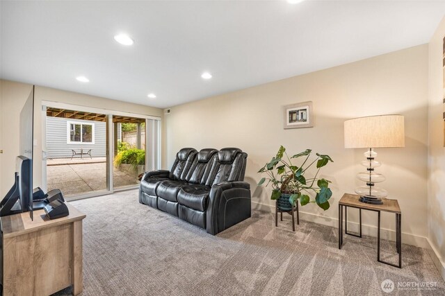 living room with carpet floors, recessed lighting, and baseboards