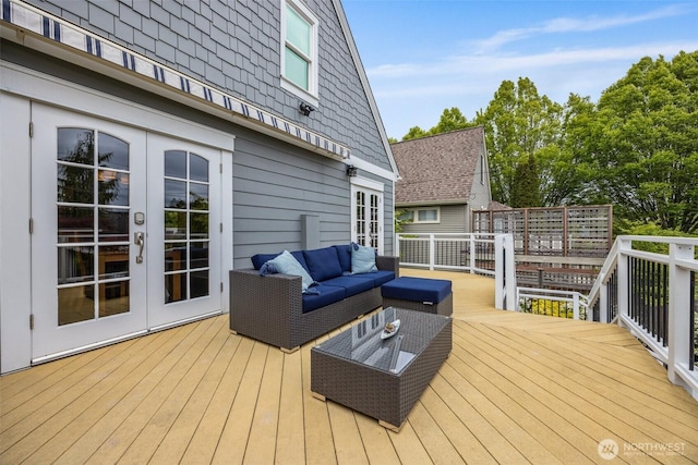 wooden deck featuring french doors and outdoor lounge area