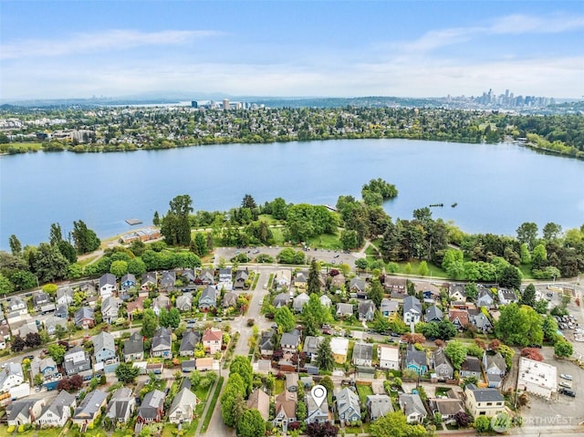 view of property location with a nearby body of water and nearby suburban area