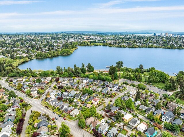 aerial perspective of suburban area featuring a nearby body of water