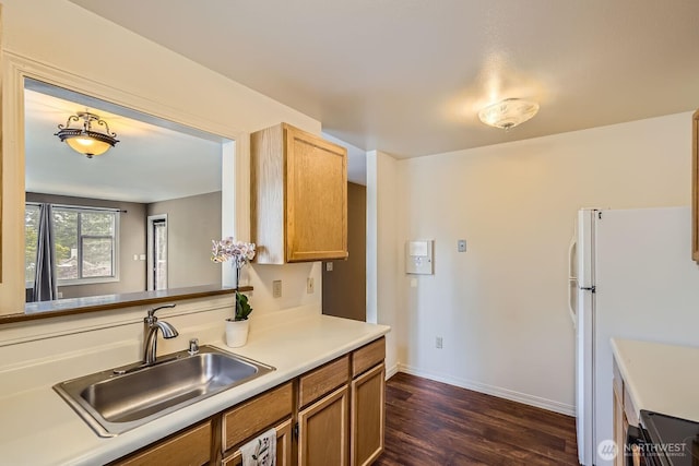 4105 Providence Point Dr SE, Issaquah, WA 98029 - kitchen with a sink, freestanding refrigerator, dark wood-style flooring, light countertops, and baseboards