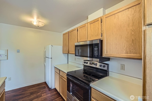 4105 Providence Point Dr SE, Issaquah, WA 98029 - kitchen featuring appliances with stainless steel finishes, light countertops, dark wood-style flooring, and baseboards