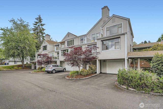 4105 Providence Point Dr SE, Issaquah, WA 98029 - view of front of house with a garage, driveway, and a chimney