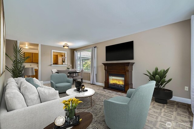 4105 Providence Point Dr SE, Issaquah, WA 98029 - living room featuring baseboards and a glass covered fireplace