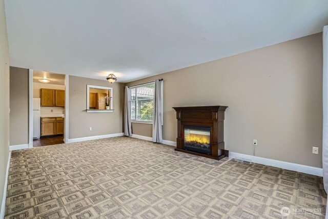 4105 Providence Point Dr SE, Issaquah, WA 98029 - unfurnished living room featuring baseboards and a glass covered fireplace