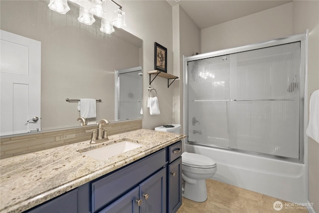 4307 Abigail Dr NE, Lacey, WA 98516 - bathroom with vanity, toilet, and bath / shower combo with glass door