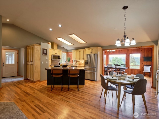 13708 401st Way, Amboy, WA 98601 - dining room with lofted ceiling, a chandelier, light wood-style floors, healthy amount of natural light, and recessed lighting