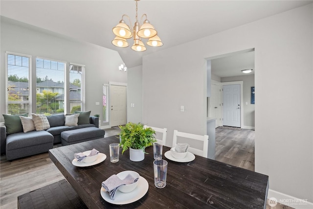 23603 SE 267th Pl, Maple Valley, WA 98038 - dining room with a chandelier, wood finished floors, baseboards, and lofted ceiling
