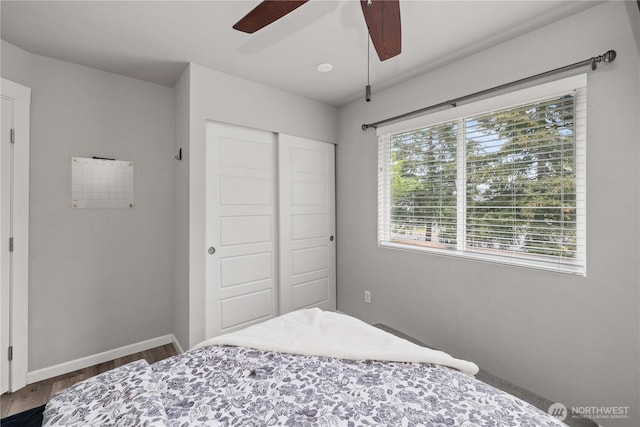 23603 SE 267th Pl, Maple Valley, WA 98038 - bedroom featuring a closet, dark wood-style floors, baseboards, and ceiling fan
