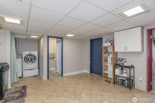 3822 Shelby Rd, Lynnwood, WA 98087 - kitchen featuring white cabinetry, open shelves, a paneled ceiling, light tile patterned floors, and baseboards