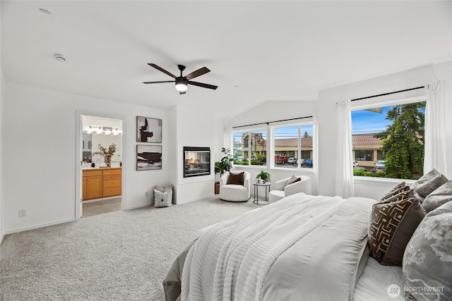 4133 156th St SW Unit 7, Lynnwood, WA 98087 - bedroom featuring carpet floors, vaulted ceiling, baseboards, ceiling fan, and ensuite bath