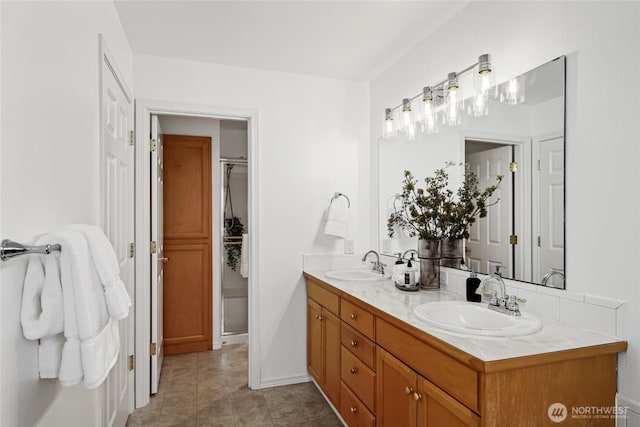 4133 156th St SW Unit 7, Lynnwood, WA 98087 - bathroom with double vanity, an enclosed shower, tile patterned floors, and baseboards