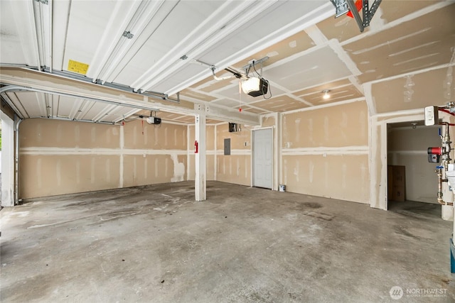4133 156th St SW Unit 7, Lynnwood, WA 98087 - garage featuring a garage door opener