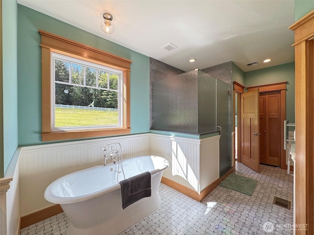 921 Chicken Coop Rd, Sequim, WA 98382 - full bathroom featuring a shower stall, a soaking tub, wainscoting, and recessed lighting