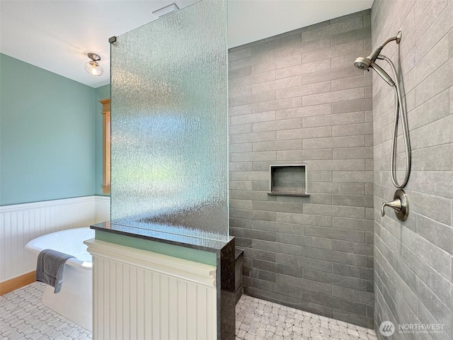 921 Chicken Coop Rd, Sequim, WA 98382 - full bathroom featuring walk in shower, a freestanding tub, and a wainscoted wall