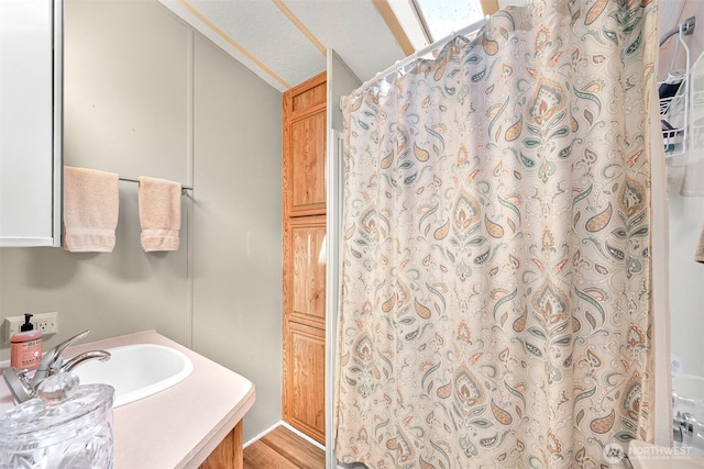 316 W Lake Samish Dr, Bellingham, WA 98229 - bathroom featuring lofted ceiling, vanity, a shower with shower curtain, and wood finished floors