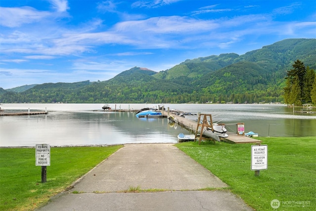 316 W Lake Samish Dr, Bellingham, WA 98229 - dock area with a forest view, a boat ramp, a water and mountain view, and a yard