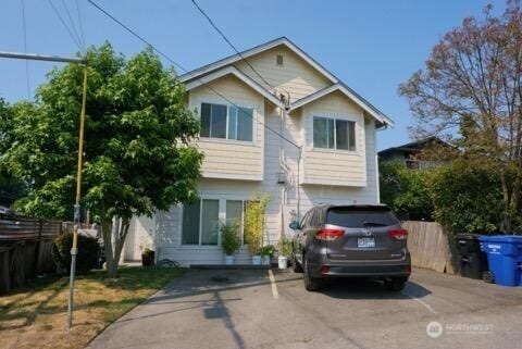 501 N 105th St Unit A, Seattle, WA 98133 - view of front of house with driveway and fence