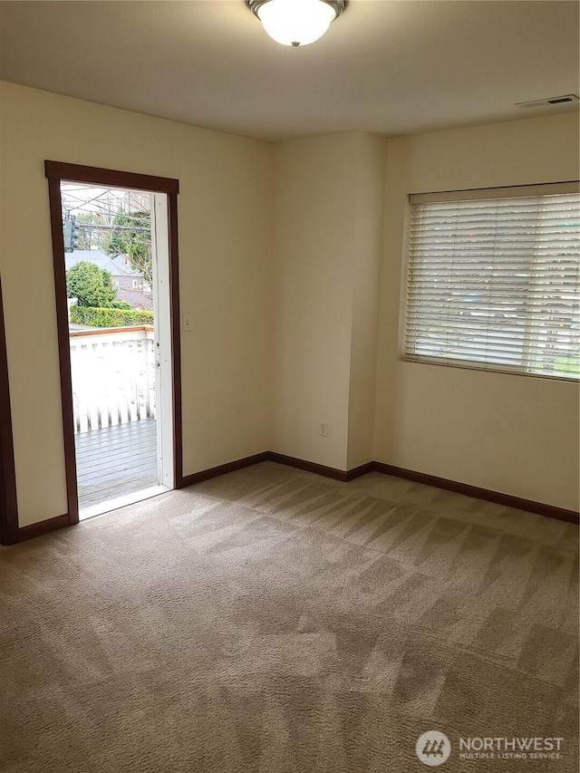 501 N 105th St Unit A, Seattle, WA 98133 - empty room with carpet floors and baseboards