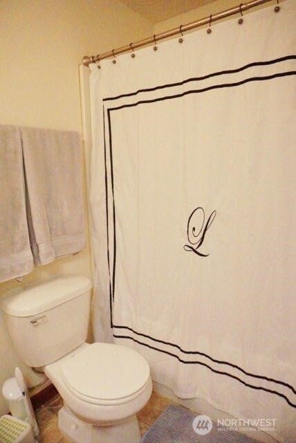 501 N 105th St Unit A, Seattle, WA 98133 - bathroom with toilet and tile patterned flooring