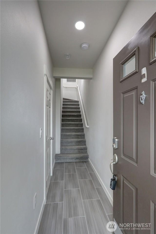 23120 SE Black Nugget Rd Unit A2, Issaquah, WA 98029 - entryway with baseboards and stairway