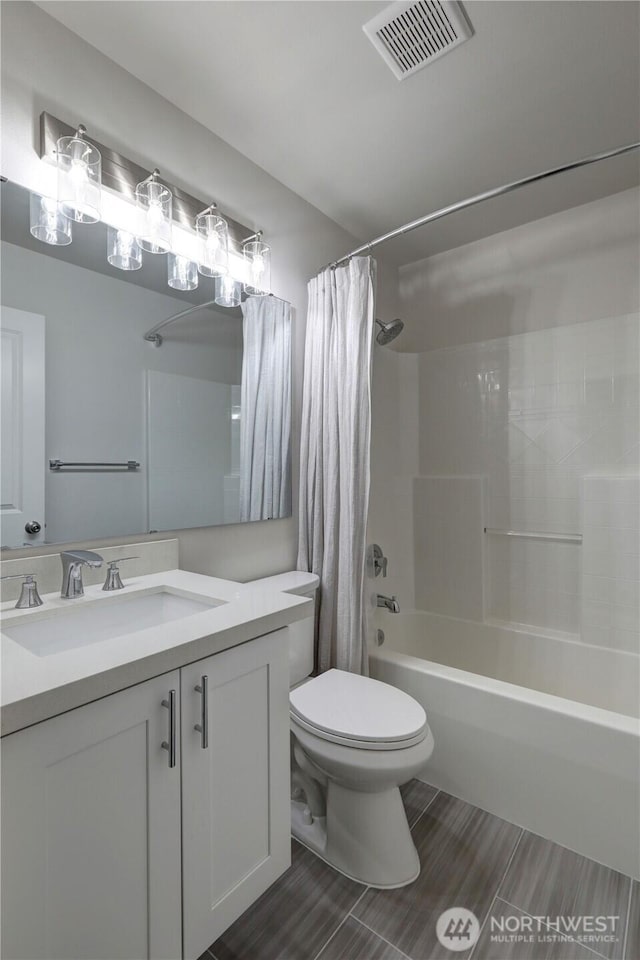 23120 SE Black Nugget Rd Unit A2, Issaquah, WA 98029 - bathroom with toilet, shower / bath combination with curtain, vanity, and wood tiled floors