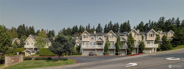 23120 SE Black Nugget Rd Unit A2, Issaquah, WA 98029 - view of front of property with driveway, a residential view, and view of scattered trees
