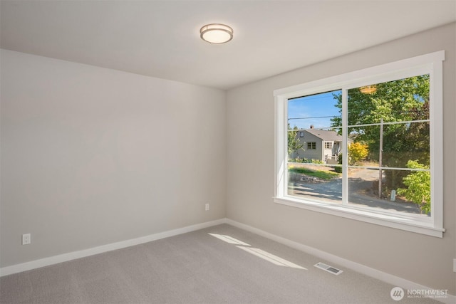 7627 10th St SE, Lake Stevens, WA 98258 - carpeted spare room featuring baseboards