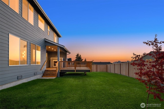 7627 10th St SE, Lake Stevens, WA 98258 - yard at dusk with a wooden deck