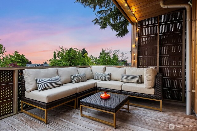 wooden terrace featuring an outdoor hangout area