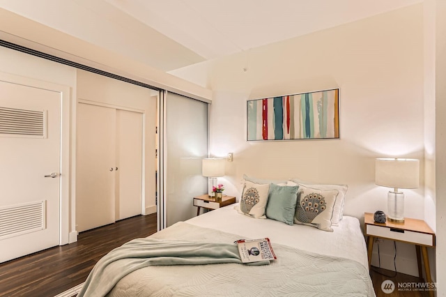2911 2nd Ave Unit 513, Seattle, WA 98121 - bedroom featuring a closet and wood finished floors