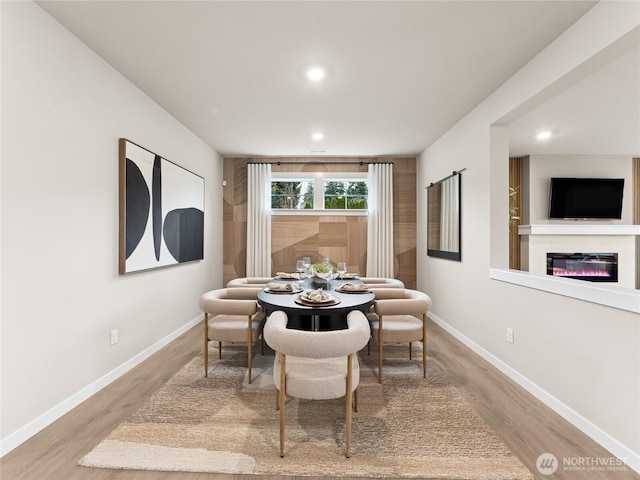 11455 SE 84th St Unit 43, Newcastle, WA 98056 - dining room featuring recessed lighting, wood finished floors, baseboards, and a glass covered fireplace