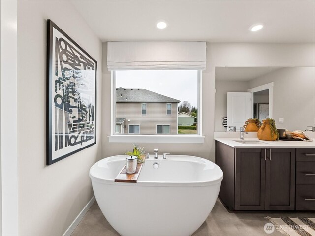 11455 SE 84th St Unit 43, Newcastle, WA 98056 - full bath with a soaking tub, vanity, baseboards, and recessed lighting