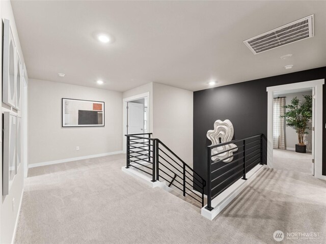 11455 SE 84th St Unit 43, Newcastle, WA 98056 - corridor with an upstairs landing, carpet flooring, recessed lighting, and baseboards