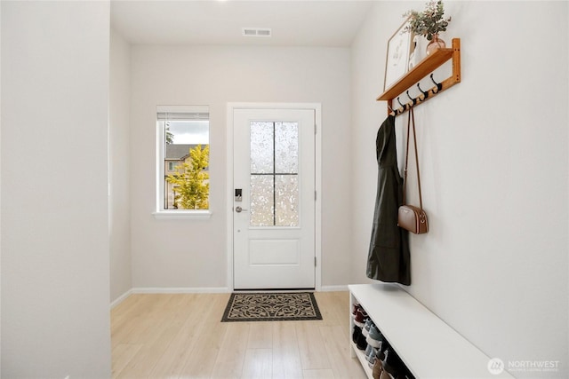 mudroom with light wood-type flooring and baseboards