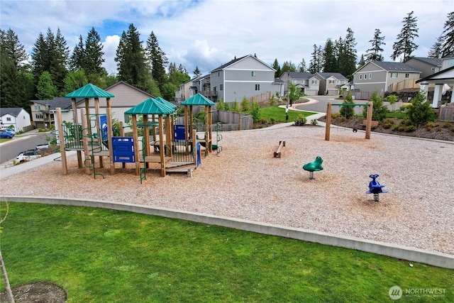 communal playground featuring a residential view